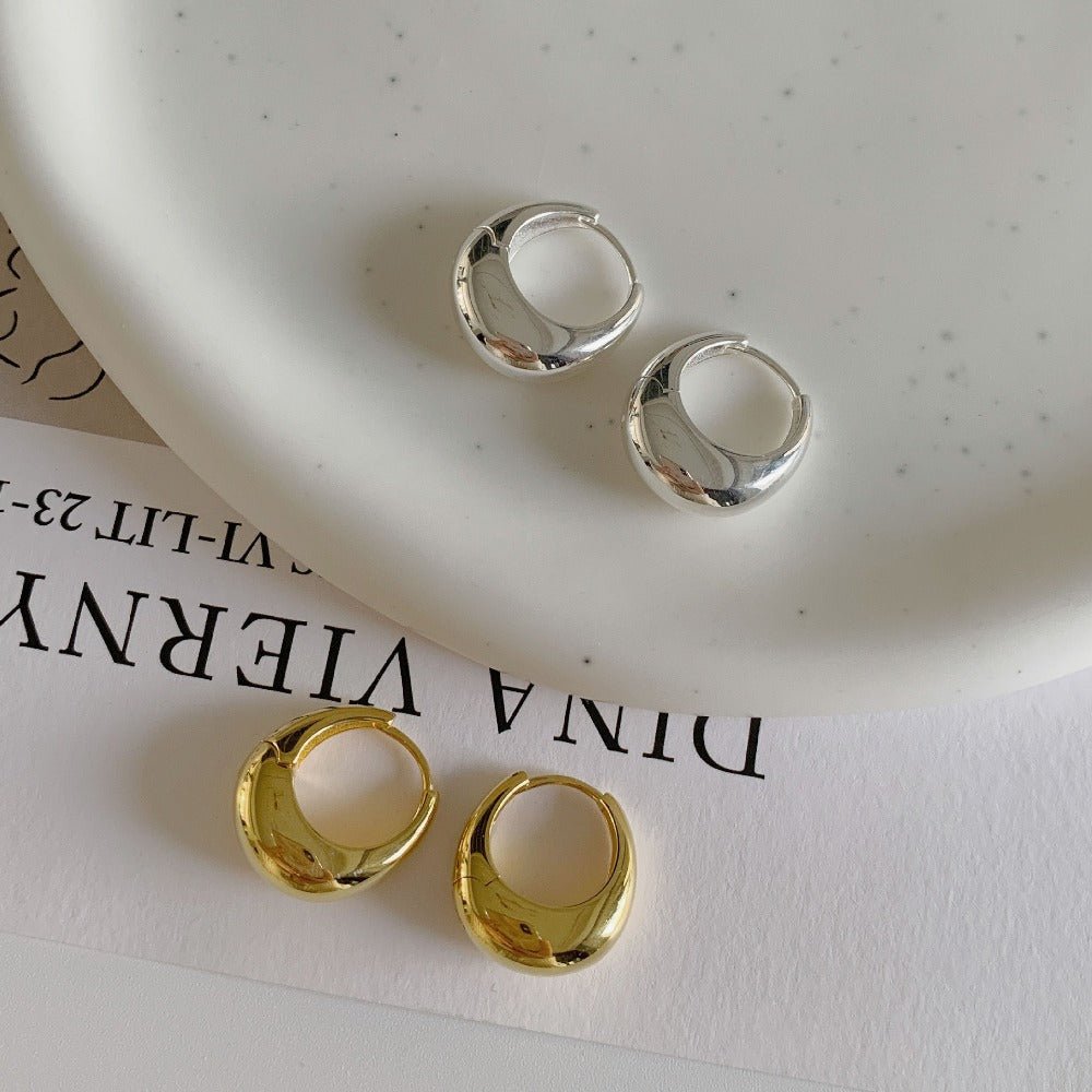 Zaniva | Opvallende maanvormige oorringen