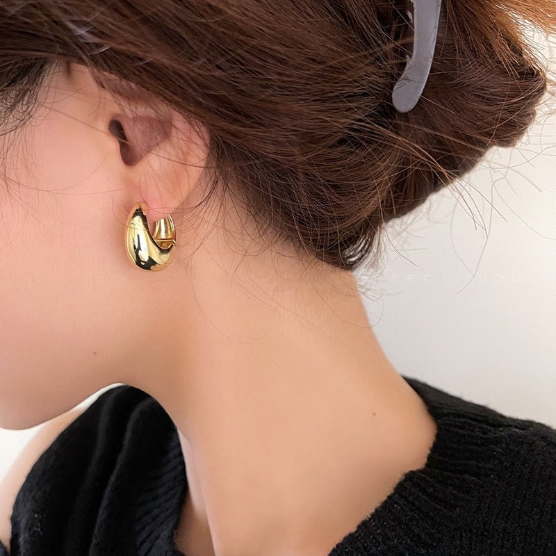 Zaniva | Opvallende maanvormige oorringen